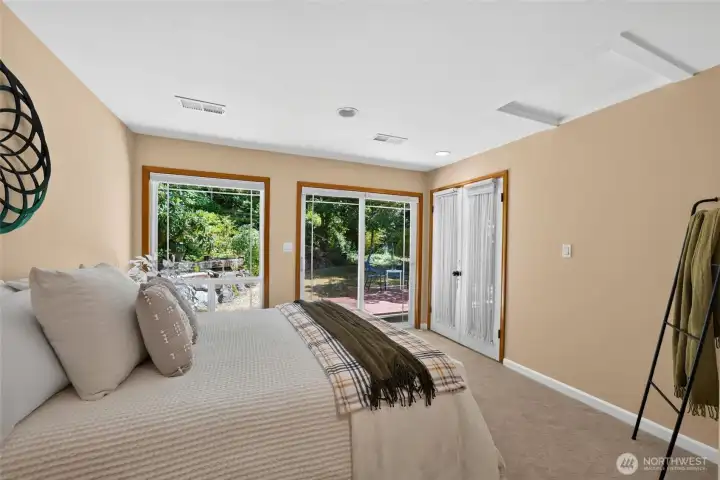 Elegant architectural details and a private slider to the backyard make this spacious primary suite a true retreat. Elegant architectural details and a private slider to the backyard make this spacious primary suite a true retreat.