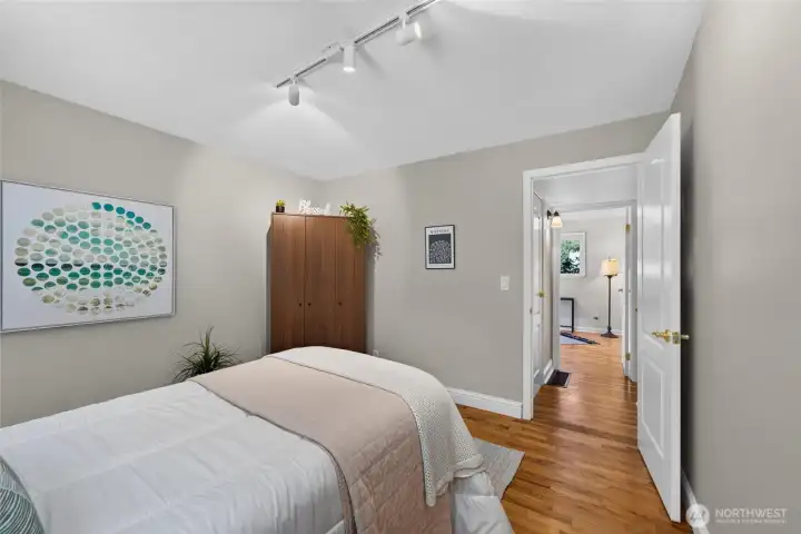 Warm colors and abundant natural light create a cozy, inviting bedroom. Warm colors and abundant natural light create a cozy, inviting bedroom.