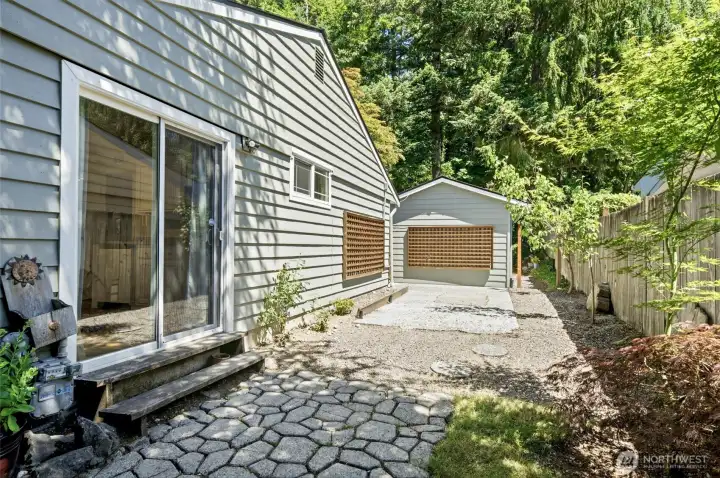 The sliding glass door provides a private side entrance, adding flexibility and convenience to this versatile space. The sliding glass door provides a private side entrance, adding flexibility and convenience to this versatile space.