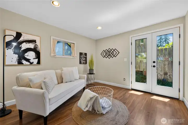 Beautiful wood flooring and French doors add warmth, charm, and easy access to the outdoors. Beautiful wood flooring and French doors add warmth, charm, and easy access to the outdoors.