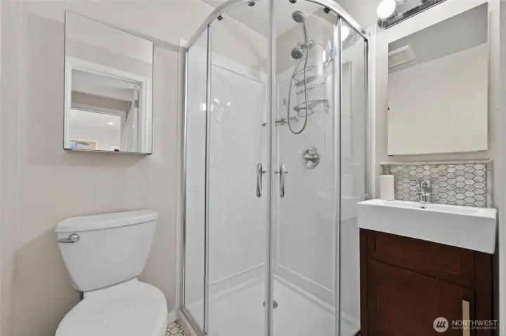 Together with the kitchen and living area, this bright ¾ bath makes the detached bonus building exceptionally functional and inviting. Together with the kitchen and living area, this bright ¾ bath makes the detached bonus building exceptionally functional and inviting.
