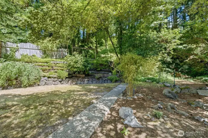 The expansive backyard invites you to unwind, gather with friends, or simply enjoy the peaceful surroundings. The expansive backyard invites you to unwind, gather with friends, or simply enjoy the peaceful surroundings.