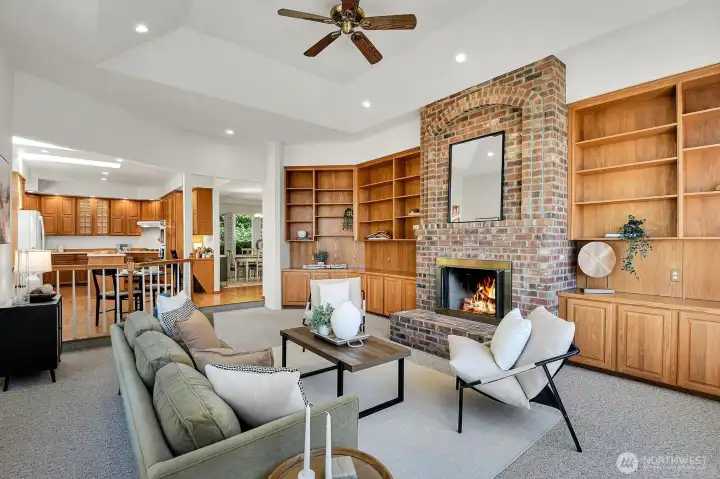 Custom built-ins and a brick fireplace make the family room a warm and inviting gathering space.