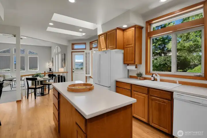 Natural light from the skylights, and generous workspaces make this kitchen both functional and inviting.