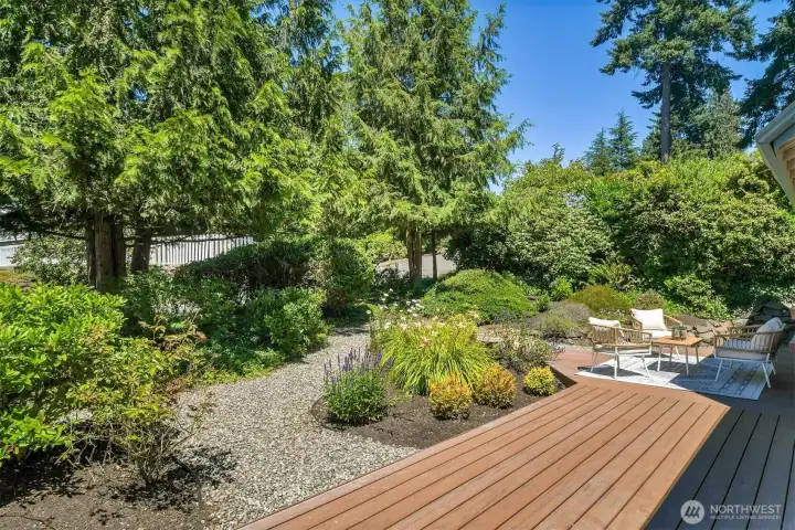 Beautifully landscaped gardens create a peaceful and private outdoor retreat.