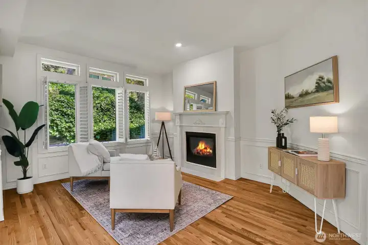 The cozy living room with fireplace offers the perfect space to relax and unwind.