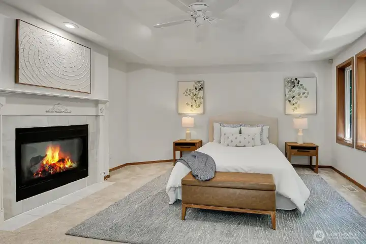 Generously sized, the primary with fireplace creates a cozy, relaxing space.