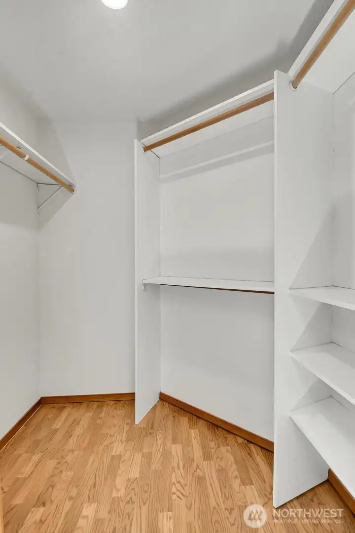 The generous walk-in closet provides excellent storage and organization.