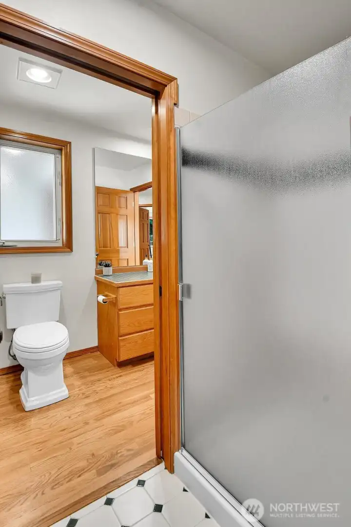 Convenient guest bath with walk-in shower.