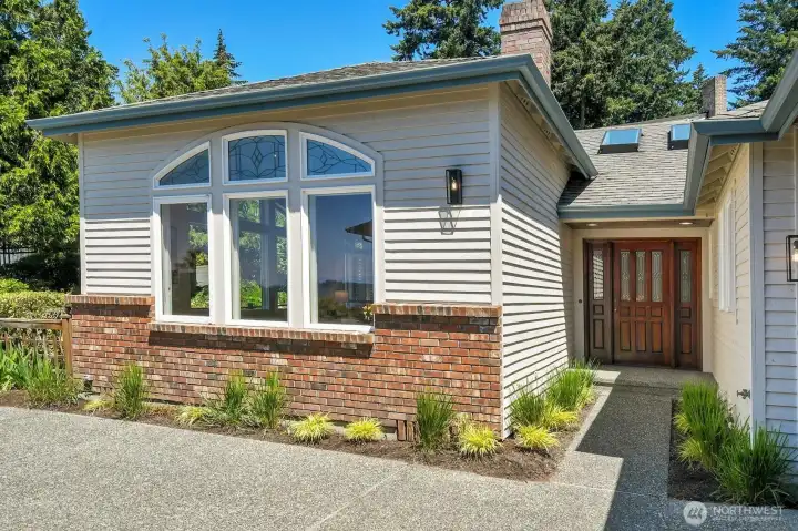 A welcoming entry showcases timeless architectural details and quality craftsmanship.