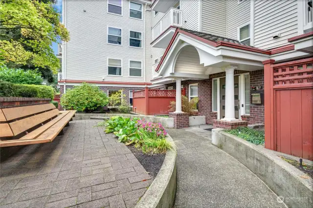 The courtyard outside the front door. Unit is on the bottom left.