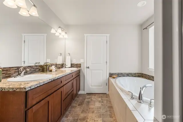 Primary Bath: double vanity, Soaking tub & Shower.