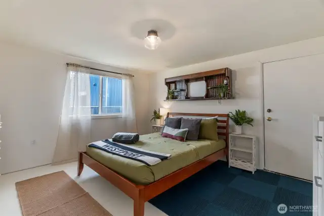 Bedroom with back door entry.