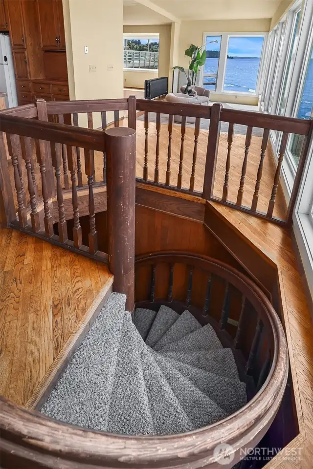 Spiral Staircase to downstairs storage for toys...canoes, paddleboards, boat, etc