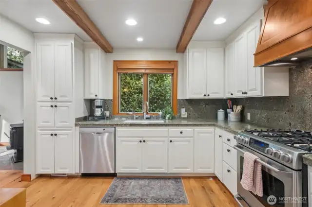 Beautiful Kitchen with Stainless steel appliances and granite countertops.