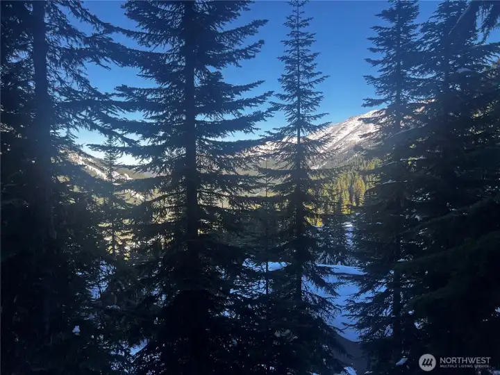 Walls of windows overlook the mountain and valley