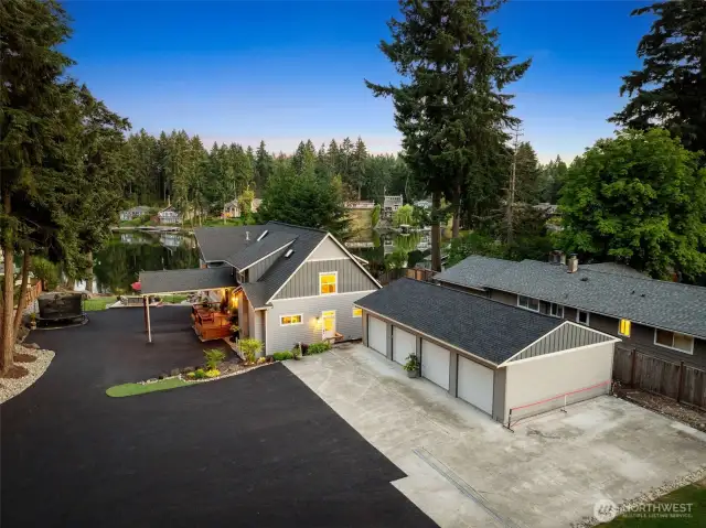 If you’ve got a fleet or plan to, this detached 4-car garage is your new best friend. With automatic openers on every door and a sprawling asphalt driveway that can fit your RV and boat plus visitors, you’ll never worry about parking again. It’s a seamless blend of function and flair, perfectly placed just steps from the home.