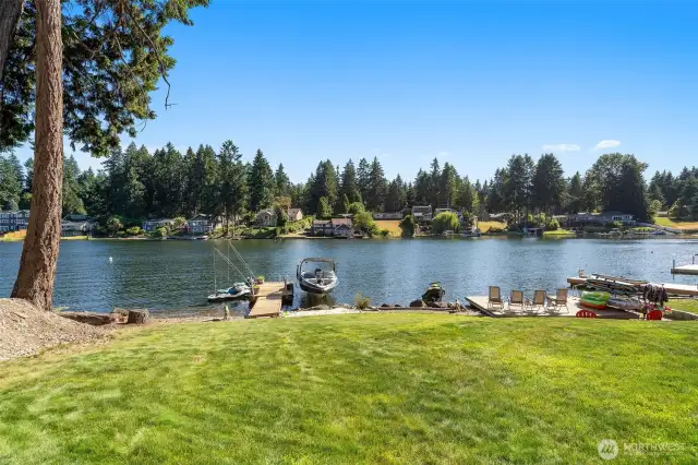 From the sprinkler systemed lawn down to the water, every detail is geared toward enjoying the lake life. Two docks extend invitingly into the calm water, while the beach area and adjacent lower deck provide versatile spots for gathering, relaxing, or launching your favorite water toys. It’s waterfront living that feels effortless and utterly inviting.