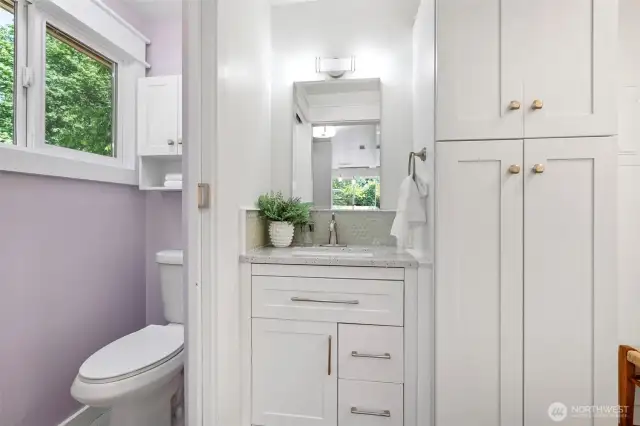 Updated half bathroom is off the back entry