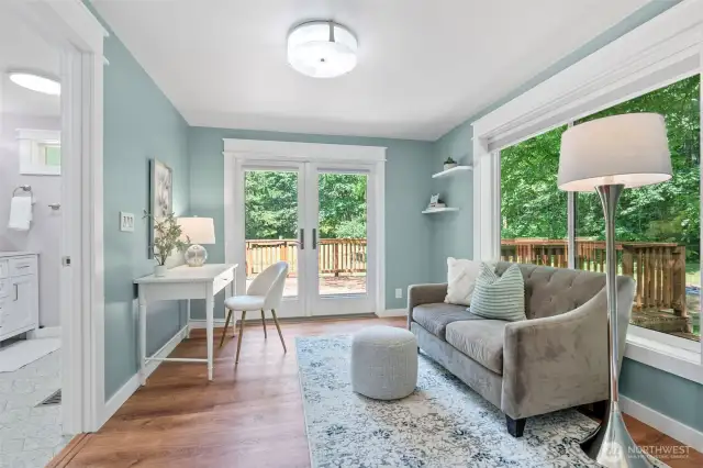Primary sitting room with French doors to back deck