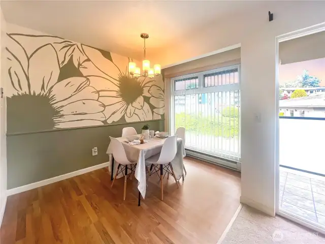 Spacious dining room with large windows overlooking the grounds.