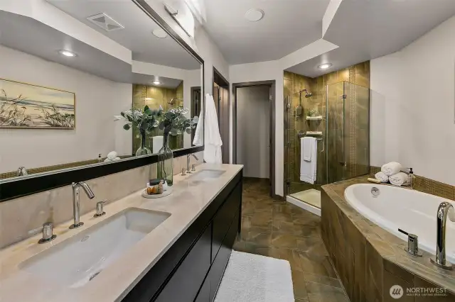 5-piece primary bath with dual vanities and oversized soaking tub.