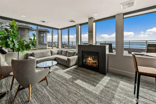 Rooftop residence lounge with gas fireplace and incredible views.