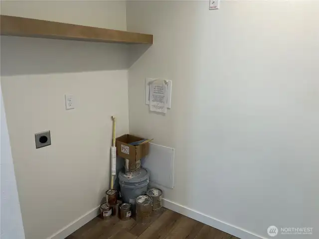 Utility room. On the other side there is plenty of room for a freezer or more storage.