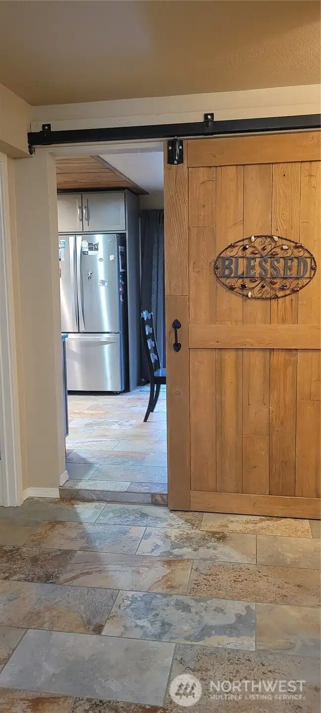Barn door from family room to dining area