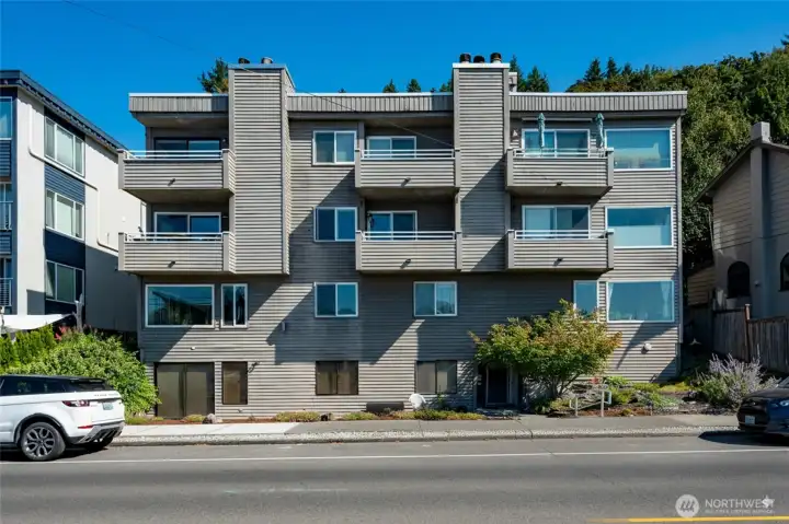 Front of building. #303 is corner unit w/deck