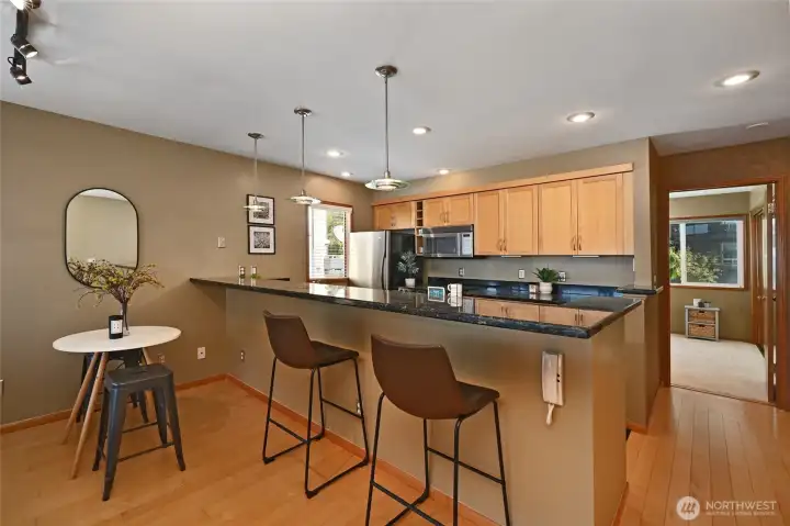 Galley kitchen includes granite and all appliances including washer and dryer.