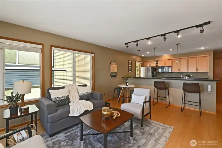 Living area w/light filled windows around the corner of unit.