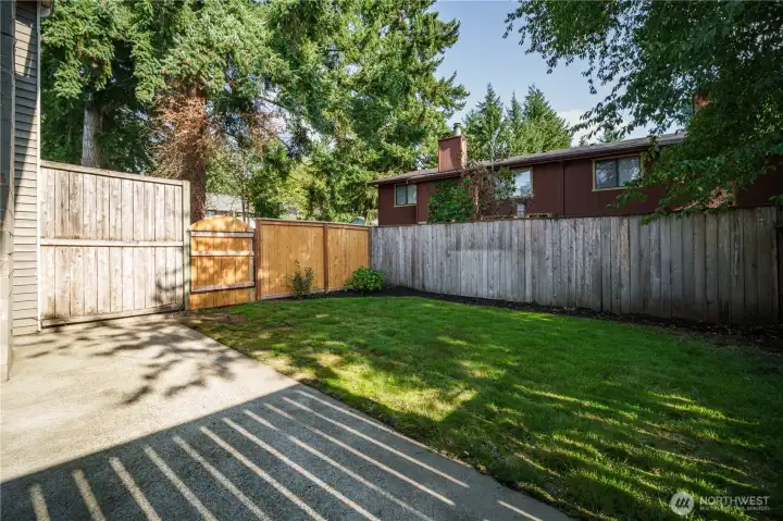 Gates on both sides allow easy access for lawn care. The HOA mows your lawn for you. No mowing needed—just add your own plantings!