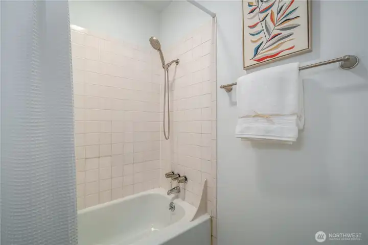 The bath area is separated by a door.