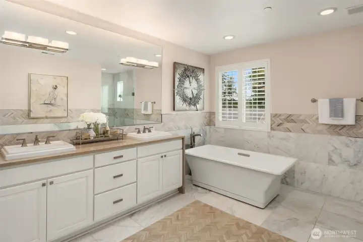 Upscale patterned tilework through out, this beautiful primary bath is a dream to have!