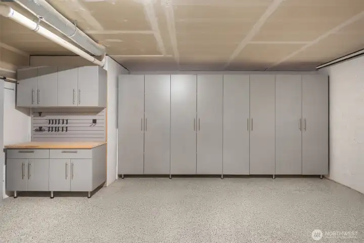 Over 20K upgrades here including epoxy floor, custom cabinets, workstation and tool racks!