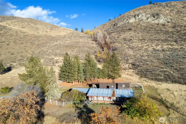 The current home site is situated at the base of a stunning natural backdrop.