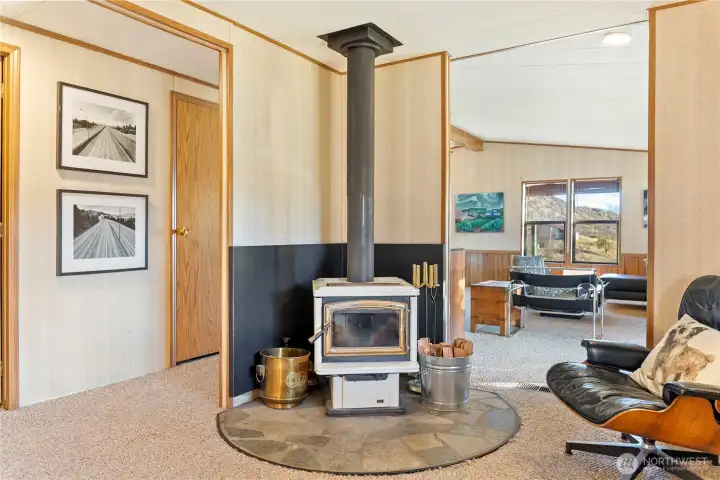 A wood stove in the den/study add to wintertime coziness