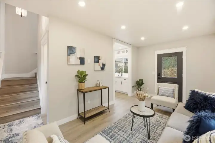 The great rooms is right off the kitchen and has the stair access to the second floor.