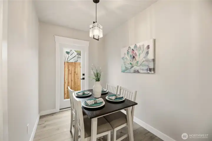 Enjoy meals in the separate dining room. Another door not provides more light, but also provides easy access to the patio.