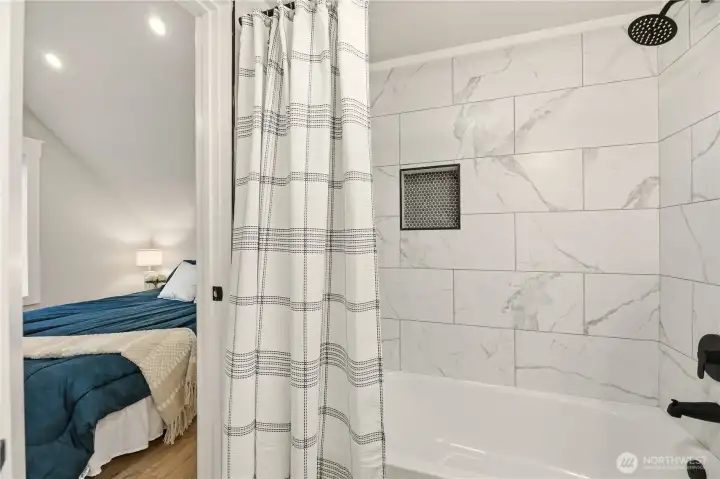 You can access the bathroom from the hall or from the primary suite.