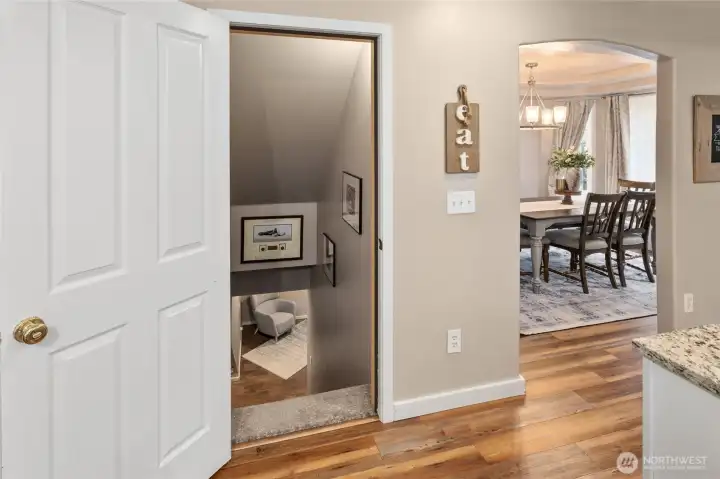 Doorway down to the fully finished basement off of the kitchen.