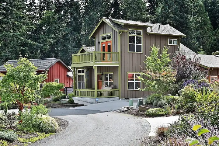Mature landscaping that preserves street appeal and proportionality plus a great window package for a light filled space.
