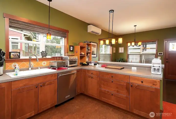 Wicander cork main flooring & Marmoleum vinyl bath flooring.  Belmont cabinets throughout.