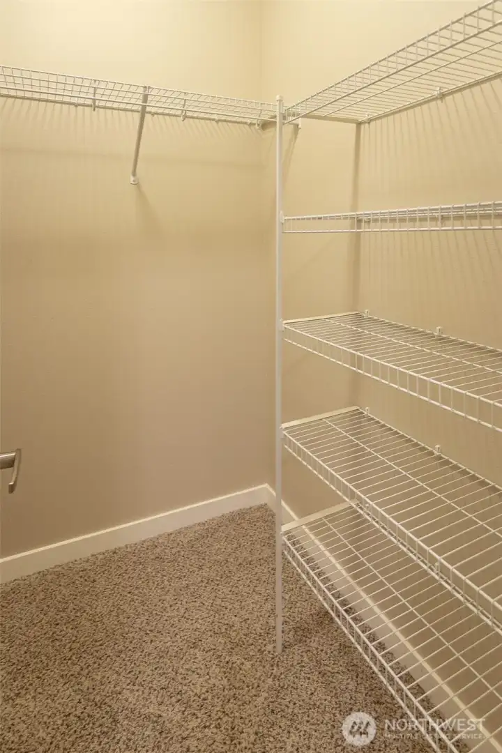 The walk-in closet in the second bedroom has lots of storage space!