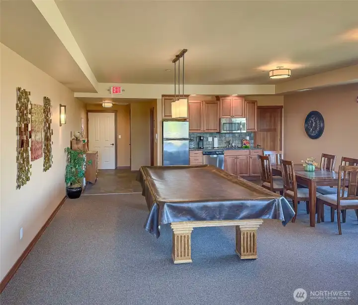The large community room has a full kitchen to entertain a large group.