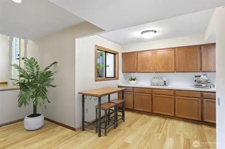 Entryway and informal dining in kitchen. Virtually staged.