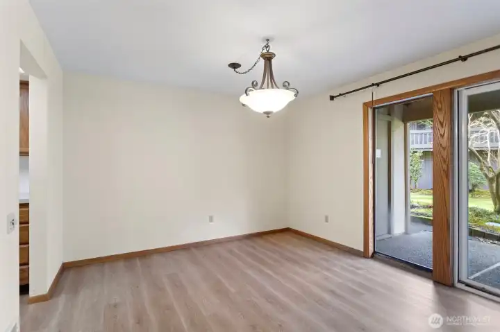 Formal dining room with luxury vinyl plank flooring.