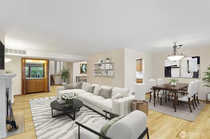 Open concept with living and formal dining rooms. Virtually staged, floors are darker in real life.