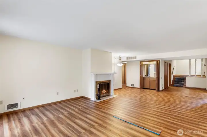 Another view of all of this space and the classy wood burning fireplace.
